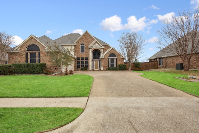 front facade with central AC and a front lawn