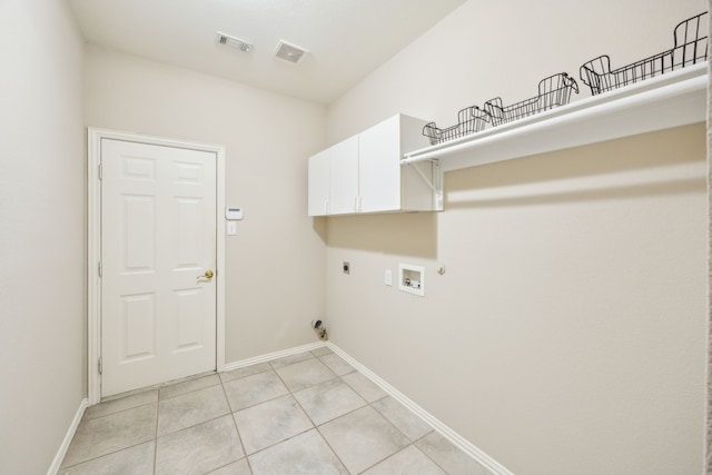 washroom with light tile patterned floors, cabinets, washer hookup, hookup for a gas dryer, and hookup for an electric dryer