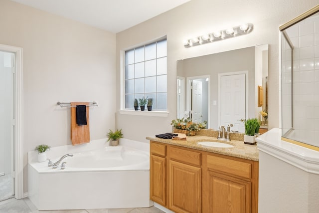 bathroom featuring vanity and independent shower and bath