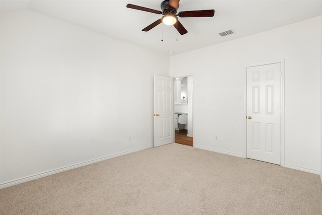 unfurnished bedroom featuring light carpet and ceiling fan