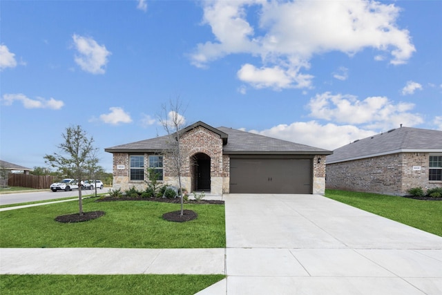 view of front of house with a garage and a front lawn