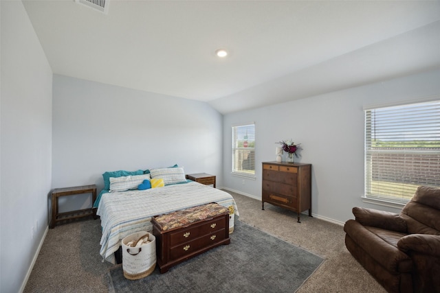 carpeted bedroom with vaulted ceiling