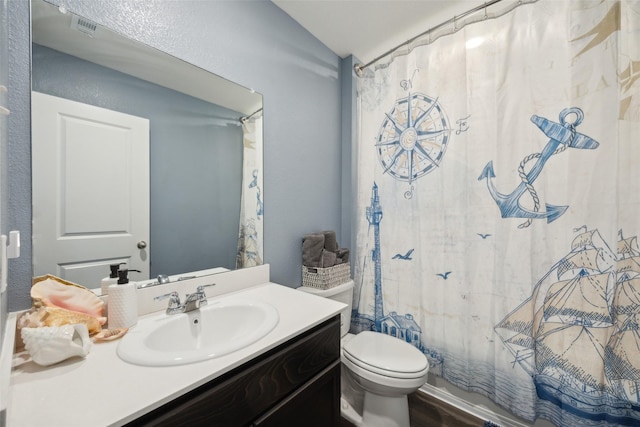 full bathroom featuring vanity, vaulted ceiling, shower / tub combo, and toilet