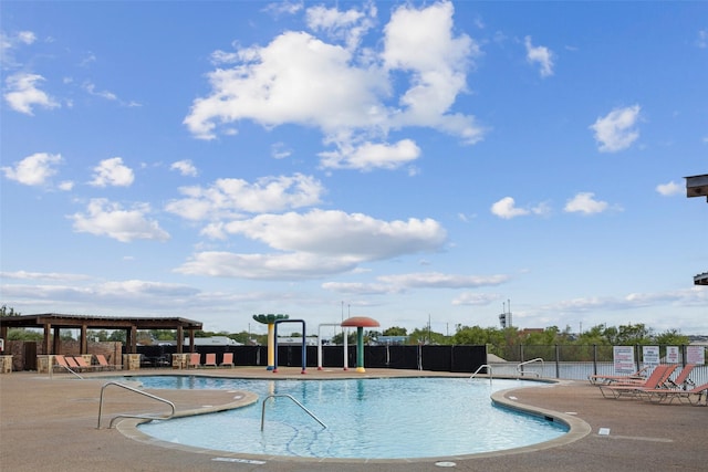 view of swimming pool with a patio area