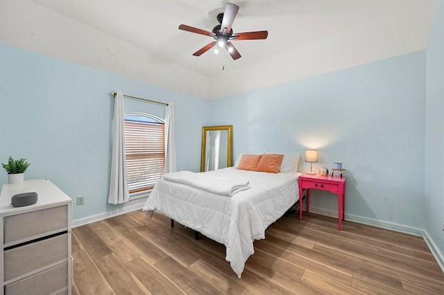 bedroom featuring hardwood / wood-style floors and ceiling fan