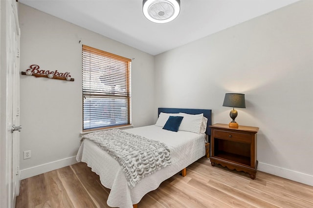 bedroom with wood-type flooring