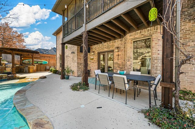 view of yard with a fenced in pool, a patio, and a balcony