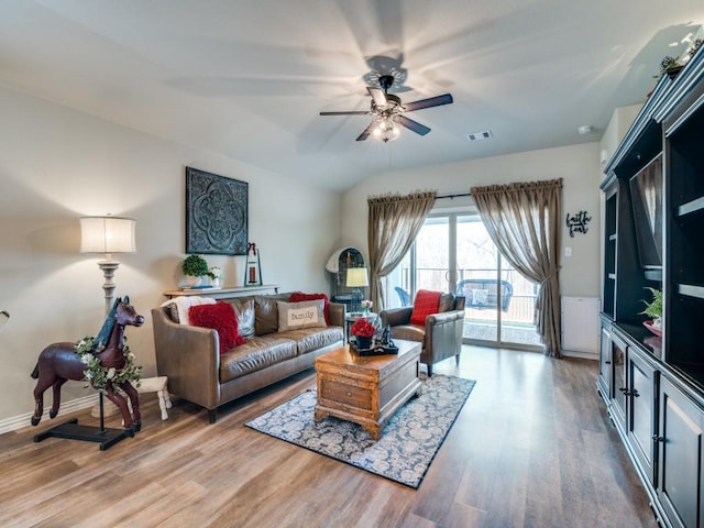 living room with hardwood / wood-style floors and ceiling fan