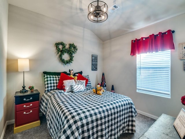 carpeted bedroom with vaulted ceiling