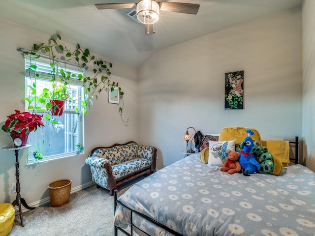 bedroom with ceiling fan, carpet flooring, and vaulted ceiling