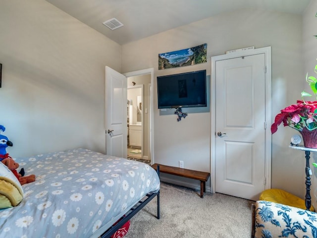 carpeted bedroom featuring vaulted ceiling