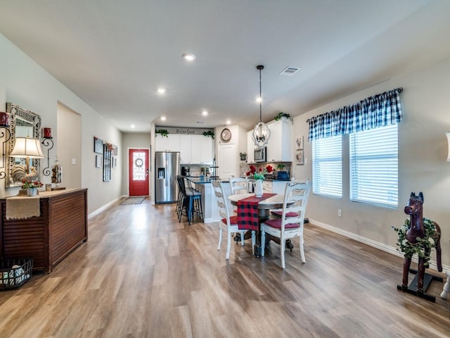 dining area featuring light hardwood / wood-style floors