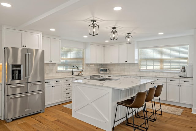209 Mary Fitch Rd, Sherman, TX 75090 - kitchen featuring high quality fridge, a sink, backsplash, white cabinets, and recessed lighting