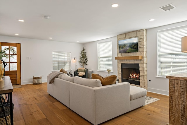 209 Mary Fitch Rd, Sherman, TX 75090 - living room with a fireplace, recessed lighting, light wood-style flooring, healthy amount of natural light, and baseboards