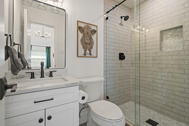 209 Mary Fitch Rd, Sherman, TX 75090 - full bath featuring a stall shower, a chandelier, toilet, and vanity