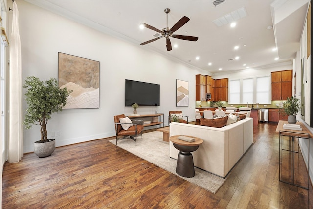2134 Canton St, Dallas, TX 75201 - living area featuring wood finished floors, ornamental molding, and a ceiling fan