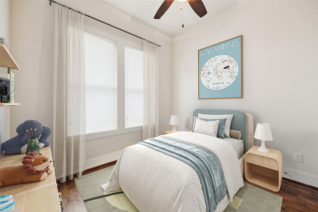 bedroom featuring dark wood-type flooring and ceiling fan