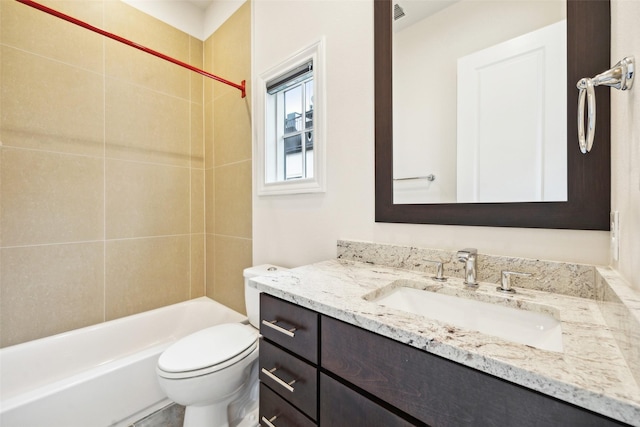 full bathroom with vanity, toilet, and tiled shower / bath combo