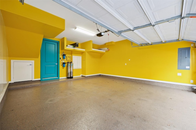 garage featuring a garage door opener and electric panel