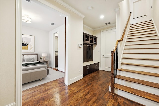 2134 Canton St, Dallas, TX 75201 - staircase featuring baseboards, visible vents, crown molding, and wood finished floors