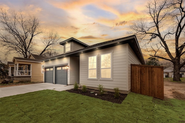 view of front facade featuring a yard and a garage