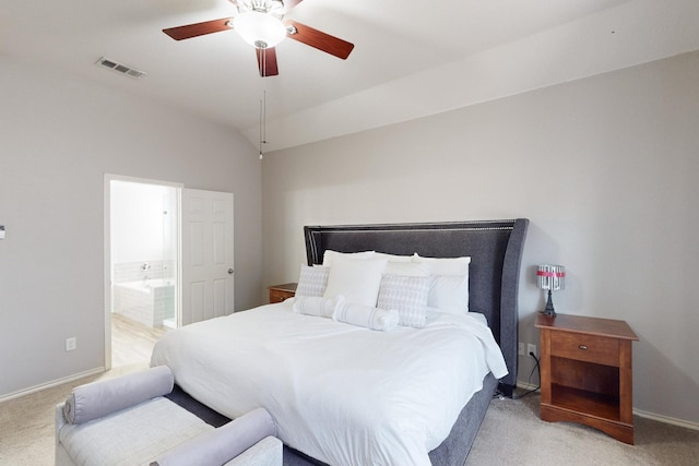 carpeted bedroom with lofted ceiling, ceiling fan, and ensuite bathroom