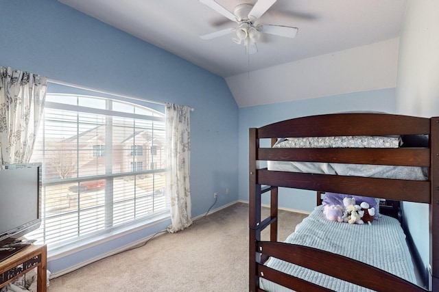 carpeted bedroom with lofted ceiling and ceiling fan