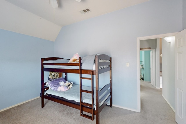 bedroom featuring lofted ceiling, light colored carpet, and ceiling fan