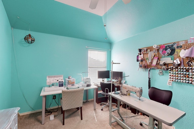 carpeted office space featuring ceiling fan