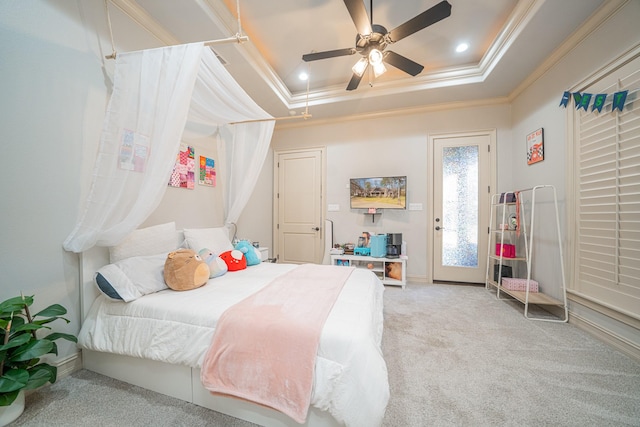 bedroom with light carpet, access to exterior, crown molding, and a raised ceiling