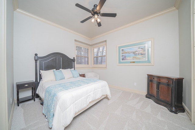 carpeted bedroom featuring crown molding and ceiling fan