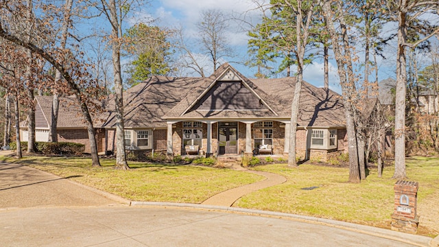 view of front of property featuring a porch and a front yard