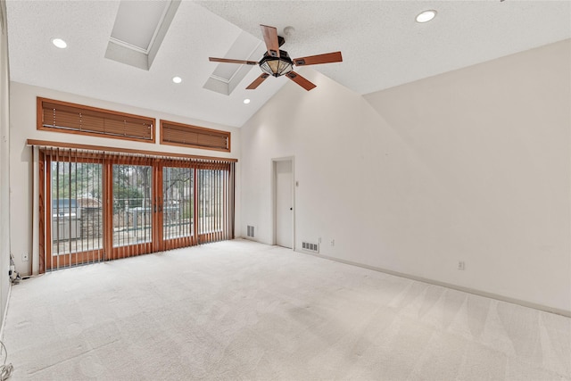 carpeted spare room with high vaulted ceiling, a textured ceiling, and ceiling fan