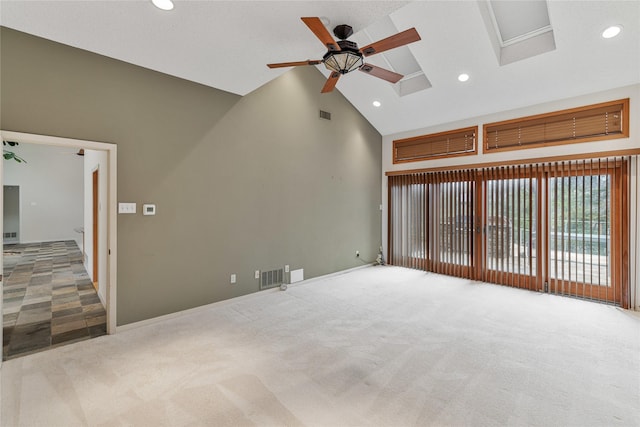 unfurnished living room featuring high vaulted ceiling, ceiling fan, and carpet