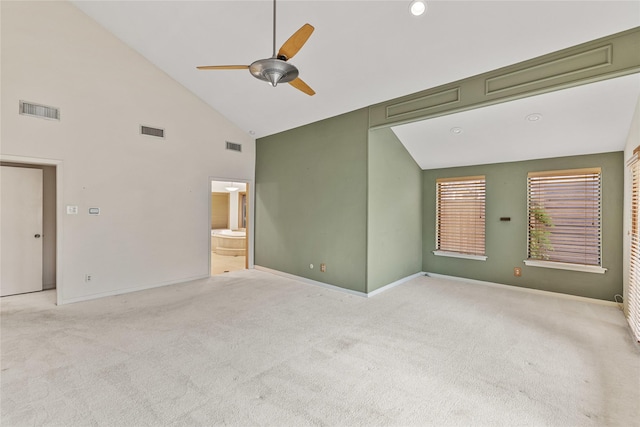 interior space featuring high vaulted ceiling, light carpet, and ceiling fan