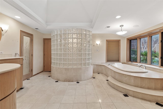 bathroom featuring tiled tub, vanity, vaulted ceiling, and tile patterned floors