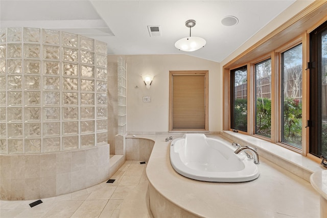 bathroom featuring lofted ceiling, tile patterned flooring, and a shower