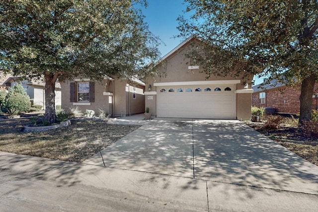 9113 Compton St, Denton, TX 76207 - view of front of property featuring stucco siding, driveway, and an attached garage