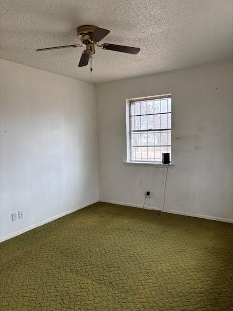 unfurnished room with ceiling fan, a textured ceiling, and carpet