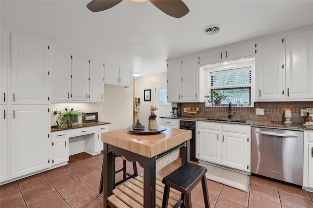 kitchen with white cabinetry, sink, and dishwasher