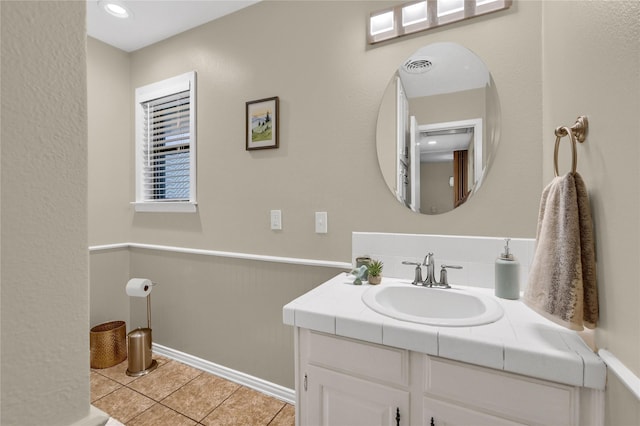 bathroom with vanity and tile patterned floors