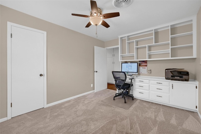 unfurnished office with light carpet and ceiling fan