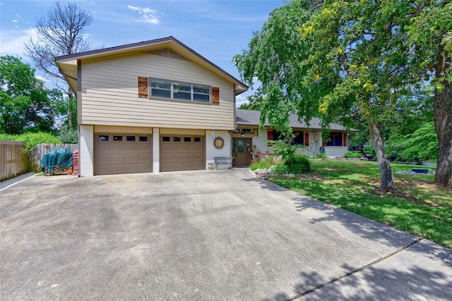 view of front of home featuring a garage and a front lawn