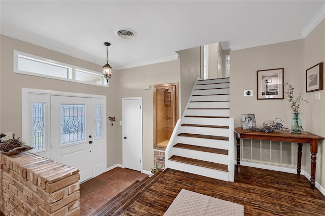 foyer entrance featuring crown molding and dark wood-type flooring