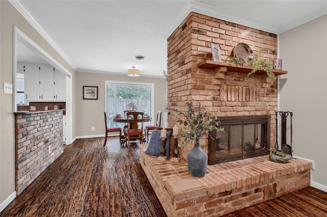 sitting room featuring ornamental molding, a brick fireplace, and dark hardwood / wood-style floors