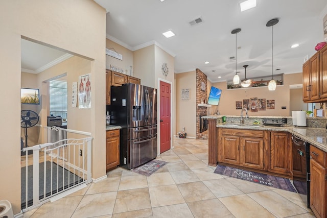 kitchen featuring pendant lighting, dishwasher, stainless steel fridge, light stone counters, and kitchen peninsula