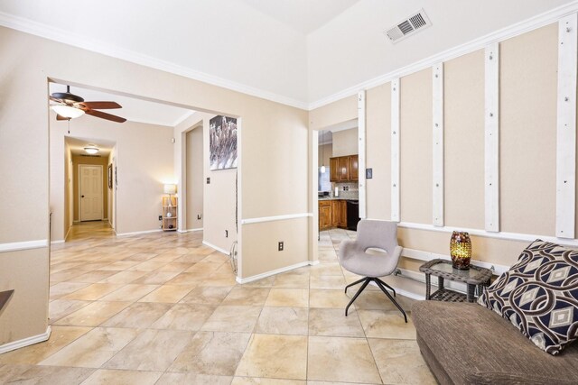 tiled entrance foyer with ornamental molding