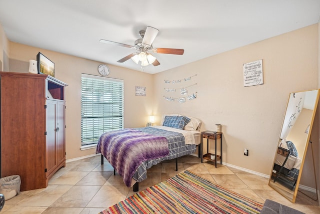 tiled bedroom with ceiling fan