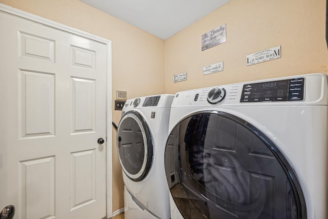 laundry room featuring washer and clothes dryer