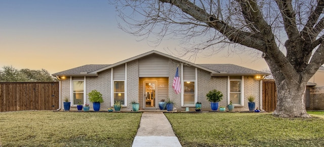 bungalow-style house with a yard